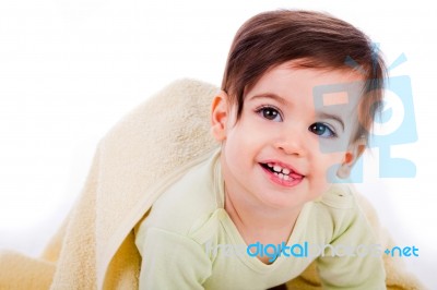 Infant Crawling With Towel And Smiling Stock Photo