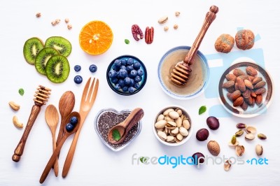 Ingredients For A Healthy Foods Background, Nuts, Honey, Berries… Stock Photo