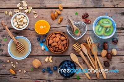 Ingredients For A Healthy Foods Background, Nuts, Honey, Berries… Stock Photo