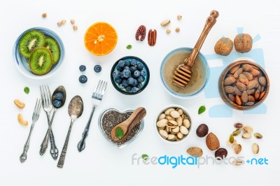 Ingredients For A Healthy Foods Background, Nuts, Honey, Berries… Stock Photo