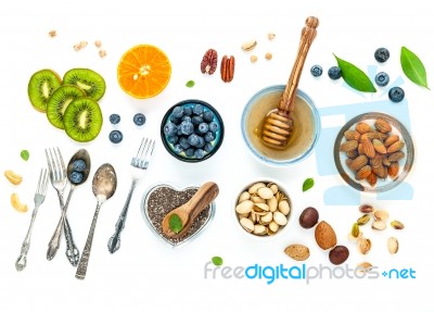 Ingredients For A Healthy Foods Background, Nuts, Honey, Berries… Stock Photo