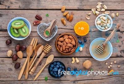 Ingredients For A Healthy Foods Background, Nuts, Honey, Berries… Stock Photo