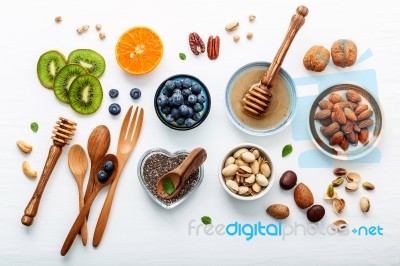 Ingredients For A Healthy Foods Background, Nuts, Honey, Berries… Stock Photo