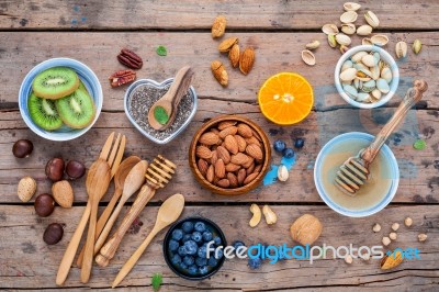 Ingredients For A Healthy Foods Background, Nuts, Honey, Berries… Stock Photo