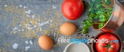 Ingredients For Baked Eggs With Tomatoes  On The Stone Table Wide Screen Stock Photo