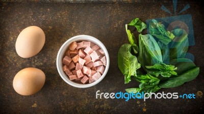 Ingredients For Florentine Eggs With Spinach On The Rusty Background Stock Photo