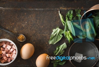 Ingredients For Florentine Eggs With Spinach On The Rusty Background Top View Stock Photo