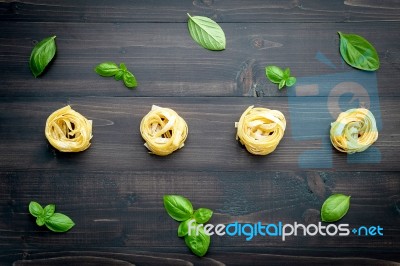 Ingredients For Homemade Pasta On Dark Wooden Background Stock Photo