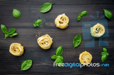 Ingredients For Homemade Pasta On Dark Wooden Background Stock Photo