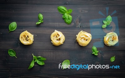 Ingredients For Homemade Pasta On Dark Wooden Background Stock Photo