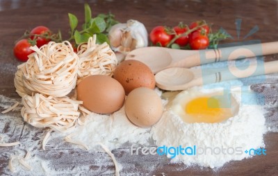 Ingredients Preparation Spaghetti With Eggs, Tomatoes Herbs And Spices Stock Photo