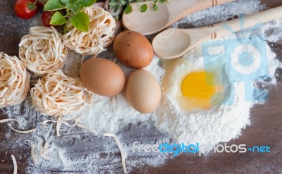 Ingredients Preparation Spaghetti With Eggs, Tomatoes Herbs And Spices Stock Photo