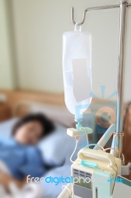 Inpatient On Bed With Bottle Dextrose In Hospital Stock Photo