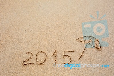 Inscription Of The Year 2015 Written In The Wet Yellow Beach San… Stock Photo