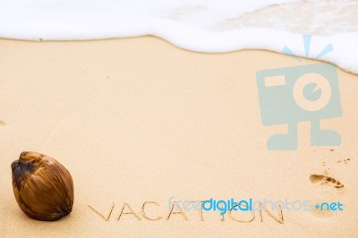 Inscription Of Word Vacation Written On Wet Yellow Beach Sand, F… Stock Photo