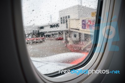 Inside A Plane Park In Airport, Raindrop On The Window, Selectiv… Stock Photo