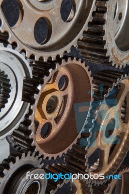 Interlocking Industrial  Cogwheels Top View On Black Background Stock Photo