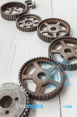 Interlocking Industrial  Cogwheels Top View On Black Background Stock Photo