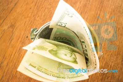 International Currencies Bank Note In The Bucket Stock Photo