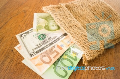 International Currencies Bank Note In The Sack Stock Photo