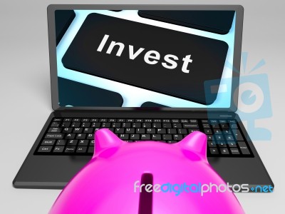 Invest Key On Laptop Showing Investment Market Stock Image