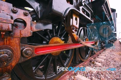 Iron Wheels Of Stream Engine Locomotive Train On Railways Track Stock Photo