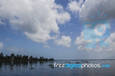 Island With Blue Sky And Water Stock Photo