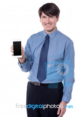 Isolated Black Businessman Showing His Cell Phone Stock Photo