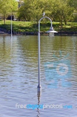 Isolated Image Of A Lights Posts In Water Stock Photo