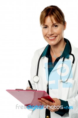 Isolated Lady Doctor Writing Prescription Stock Photo