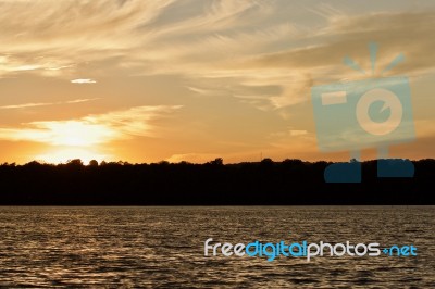 Isolated Photo Of An Amazing Sunset On A Lake Stock Photo