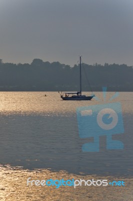 Isolated Picture With A Lake And Boat On Sunset Stock Photo