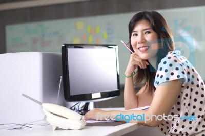 It Girl Sitting Infront Of Computer Stock Photo