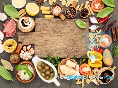 Italian Food Cooking Ingredients On Dark Stone Background With C… Stock Photo