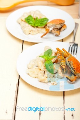 Italian Gnocchi With Seafood Sauce With Crab And Basil Stock Photo