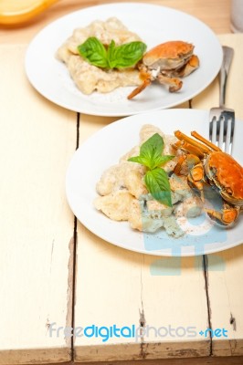 Italian Gnocchi With Seafood Sauce With Crab And Basil Stock Photo