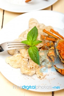 Italian Gnocchi With Seafood Sauce With Crab And Basil Stock Photo