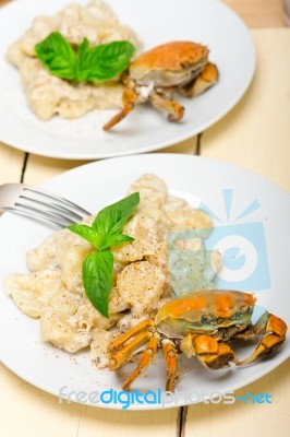 Italian Gnocchi With Seafood Sauce With Crab And Basil Stock Photo