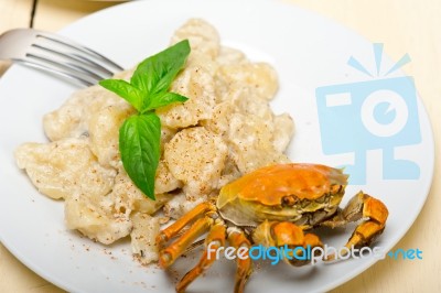 Italian Gnocchi With Seafood Sauce With Crab And Basil Stock Photo