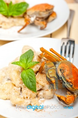 Italian Gnocchi With Seafood Sauce With Crab And Basil Stock Photo