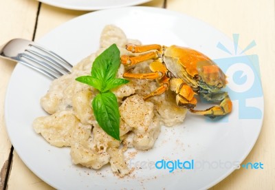 Italian Gnocchi With Seafood Sauce With Crab And Basil Stock Photo