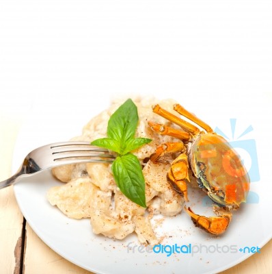 Italian Gnocchi With Seafood Sauce With Crab And Basil Stock Photo