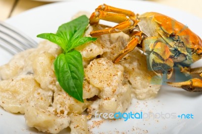 Italian Gnocchi With Seafood Sauce With Crab And Basil Stock Photo