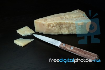 Italian Parmesan Cheese With Knife Stock Photo