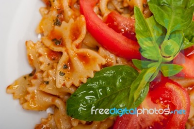 Italian Pasta Farfalle Butterfly Bow-tie And Tomato Sauce Stock Photo