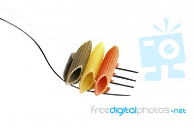 Italian Penne Pasta On A Fork Stock Photo