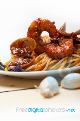 Italian Seafood Spaghetti Pasta On Red Tomato Sauce Stock Photo