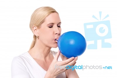 It's Hard Blowing A Balloon Stock Photo