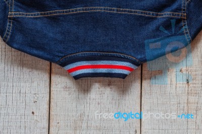 Jackets Of Jeans On Wooden Stock Photo