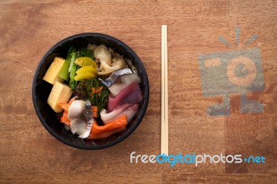 Japanese Food Tekka Don Take Away On Wooden Background Stock Photo